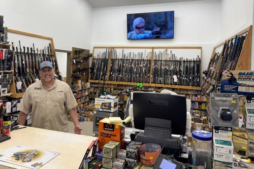 Carl Adams standing in the gun shop at Timberline Sports-N-Convenience in Blackduck