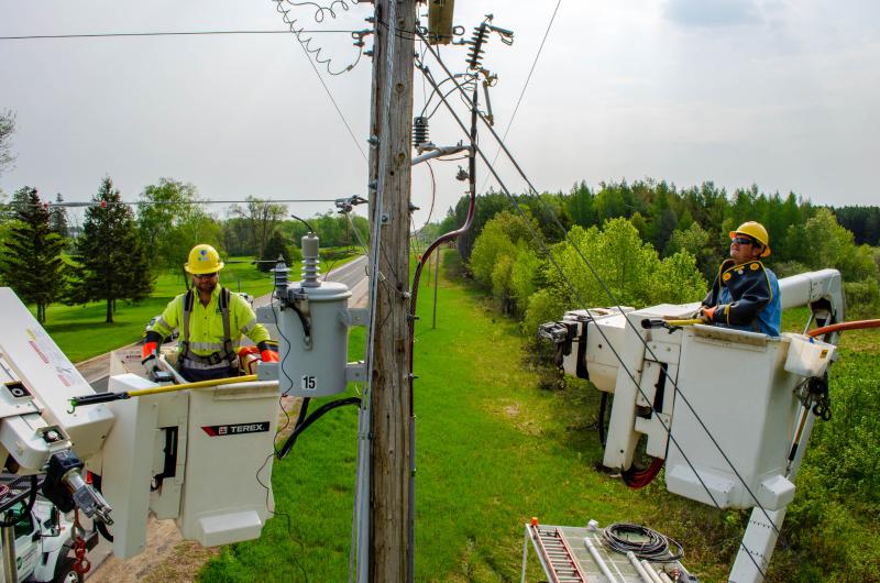 BEC lineworkers working on overhead power lines