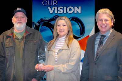 Photo of Kevin and Joyce Day with President and CEO of Beltrami Electric Cooperative, Jared Echternach